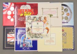 Eleven Royal Mint United Kingdom bank coin sets.