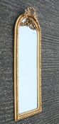 A gilt-framed mirror. 55 x 149 cm.