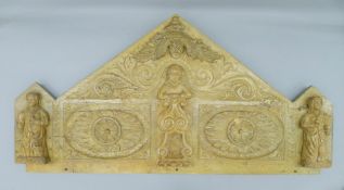 An 18th century and later carved oak panel.