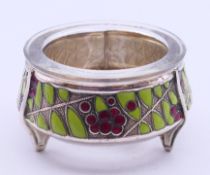 A white metal and enamel decorated salt with glass liner, stamped 810MMET u2p80k on base. 3.