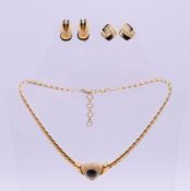 A Dior jewellery set comprising a necklace and two pairs of earrings.