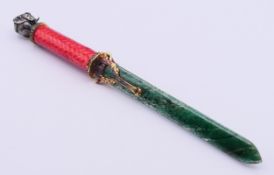A silver and enamel letter opener with elephant finial, bearing Russian marks 23 cm long.