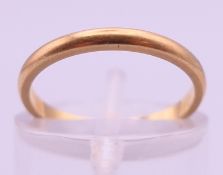 A 14 ct gold wedding band. Ring size J. 1.5 grammes.