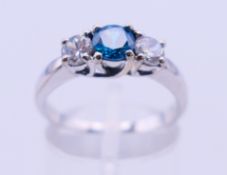 A 14 ct white gold white and blue topaz ring. Ring size O/P. 4.5 grammes total weight.
