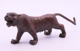 A bronze tiger. 14 cm long, 5 cm high.