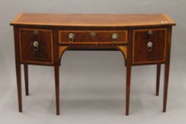 A 19th century satinwood cross-banded mahogany bowfront sideboard. 153 cm wide.