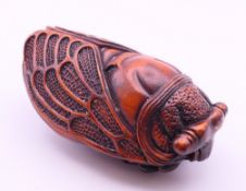 A cicada carving. 7 cm long.