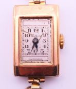 A Wilkins 9 ct gold cased Art Deco ladies' wristwatch on a rolled gold watch strap. 1.5 x 2.