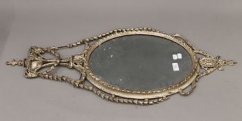 A 19th century silvered gesso wall glass. 95 cm high.