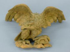 A 19th century carved pine eagle surmount. 23.5 cm wide.