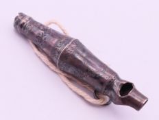 A 19th century silver whistle. 8 cm long.