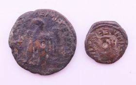 Two antique coins. 2.5 cm diameter and 1.7 cm diameter.
