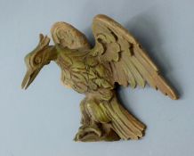 A 19th century carved pine ho-ho bird surmount. 19 cm wide.