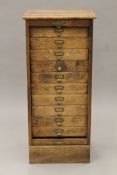 An early 20th century oak tambour-fronted filing cabinet. 106.5 cm high x 48 cm wide.