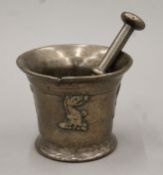 A 17th/18th century bronze pestle and mortar. The latter 11.5 cm high.