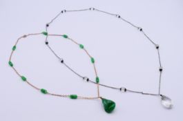 Two Art Deco pendant necklaces.