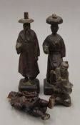Four Chinese carved wooden figures. The largest 20 cm high.