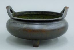 A Chinese bronze censer. 17.5 cm diameter.