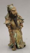 A 19th century Satsuma pottery figure of a warrior. 30 cm high.