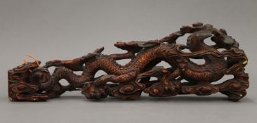 A 19th century Chinese lacquered carving of a dragon. 45 cm long.