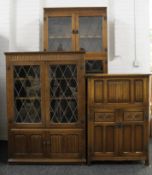 Two glazed oak cabinets and a cocktail cabinet. The largest 91.5 cm wide x 203.5 cm high.