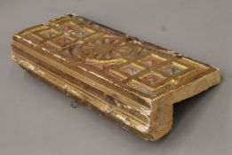 An antique carved, painted and gilded wooden panel, possibly Spanish. 49 cm long.