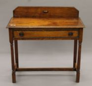 An oak single drawer side table. 92 cm wide.