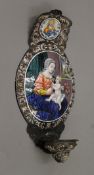 An early Limoges enamel water stoup with vignettes of God and the Virgin Mary with the Christ child,