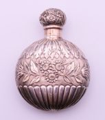 A Victorian embossed silver scent bottle. 8 cm high. 40.9 grammes.