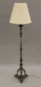A metal standard lamp with shade. 155 cm high overall.