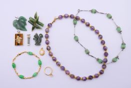 A quantity of various jewellery, to include two bead necklaces, a bead brooch, five pendants,