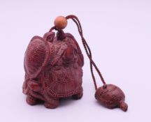 A hardwood tortoise inro. 8.5 cm high.