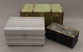 Two vintage wooden trunks and a vintage tin trunk. The largest 98 cm long.