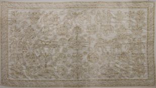 A large Indian silk embroidery depicting various figures and animals including elephants,