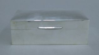 A silver cigarette box. 14 cm wide.