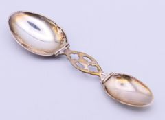 A sterling silver double-ended folding medicine spoon, marked GORHAM 514. 17 cm open, 6.
