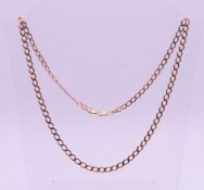A 9 ct gold curb link chain. 60 cm long, 0.5 cm high. 13.8 grammes.