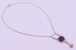 An Edwardian unmarked silver, pearl and amethyst necklace. 39 cm long, pendant 6 cm high.