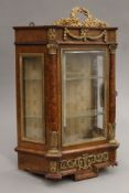 A 19th century ormolu-mounted amboyna wall cabinet. 47 cm high x 28 cm wide.