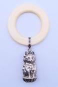 A silver cat form baby rattle with teething ring. Cat 4.5 cm high, ring 5.8 cm diameter.