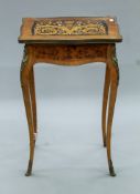 A 19th century French inlaid side table. 47 cm wide.