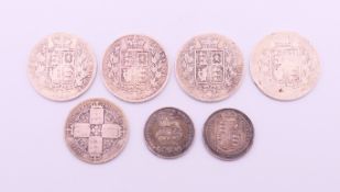 A quantity of British silver coins to include four Victorian half-crowns, a Victorian florin,