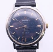 An Omega Geneve gentlemen's wristwatch. 3.5 cm diameter including crown.