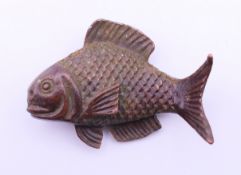 A bronze fish. 5.5 cm long, 4 cm high.