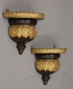 A pair of Victorian gilt-heightened wall brackets. Each 16 cm wide.