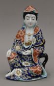 A Japanese pottery figure of Kannon. 23 cm high.