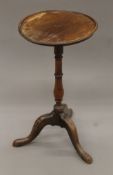 A 19th century mahogany tripod table. 35 cm diameter.