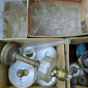 A large quantity of Victorian oil lamp parts, including reservoirs,
