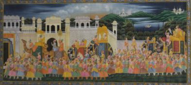 A large Indian watercolour and gouache depicting a colourful Procession, framed and glazed.