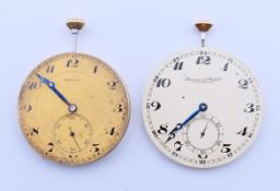 Two pocket watch movements and glass - one International Watch Company (IWC) and the other Zenith,